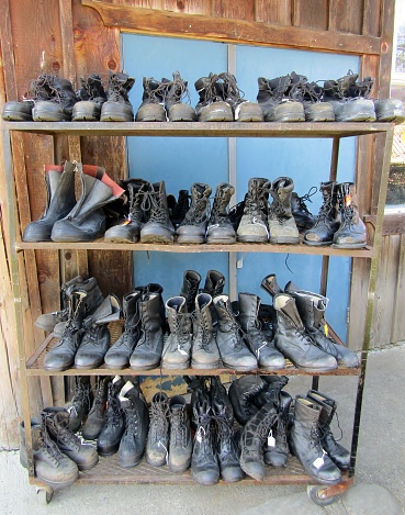 Rows of old used military boots