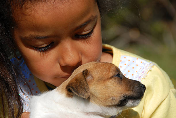 istock little girl and puppy 146883864
