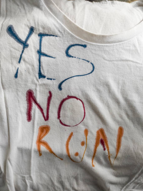 istock Writing Yes, No and Run on T-Shirt with Ink 1468839507