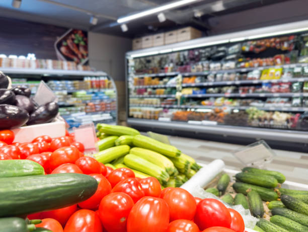 istock buying vegetables(cucumbers, peppers, tomatoes) at the market 1468839741