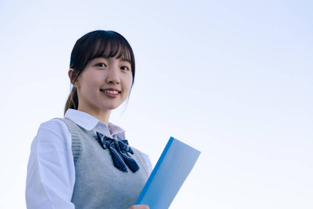istock A high school girl in uniform looking far outside 1468839806