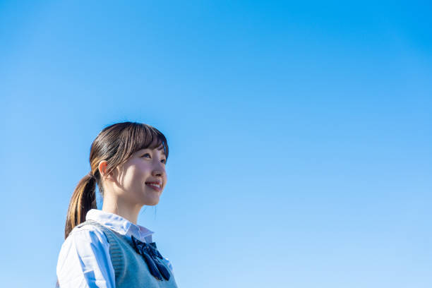 istock A high school girl in uniform looking far outside 1468839880