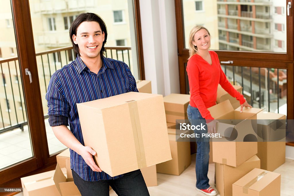 Couple Moving Into New Home http://www.edkafelek.com/athome.jpg Adult Stock Photo