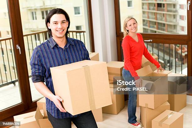 Couple Moving Into New Home Stock Photo - Download Image Now - Adult, Adults Only, Apartment