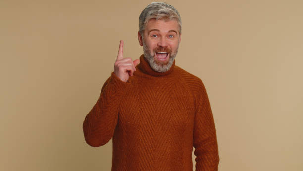 istock Inspired mature man having good idea, plan, startup showing inspiration motivation Eureka gesture 1468844807