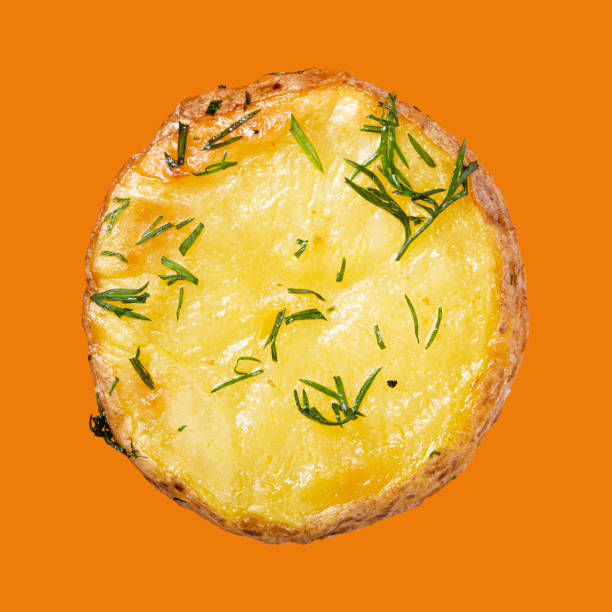 Baked potato with herbs isolated on the background.
