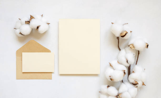 istock Blank cards and envelope with cotton flowers top view on white, wedding mockup 1468846478