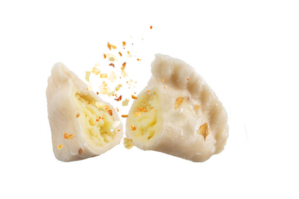 Sliced dumpling and potato stuffing with spices. stock photo