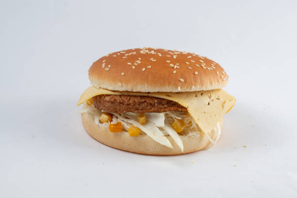 istock Burger with cutlet, vegetables and cheese in a white sesame bun 1468846917
