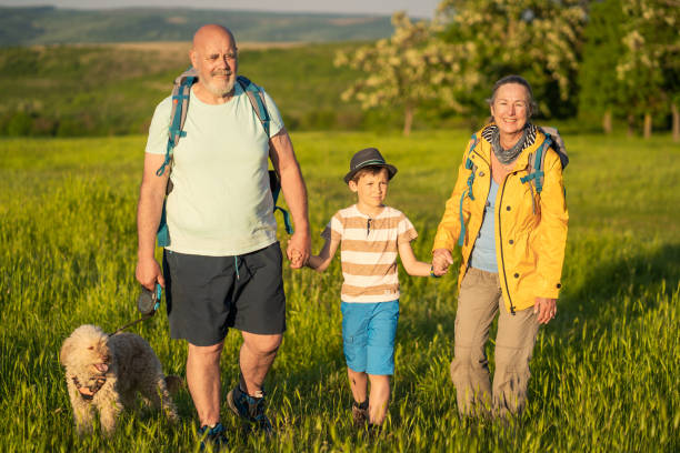 istock Mature seniors a young boy and a dog 1468847600