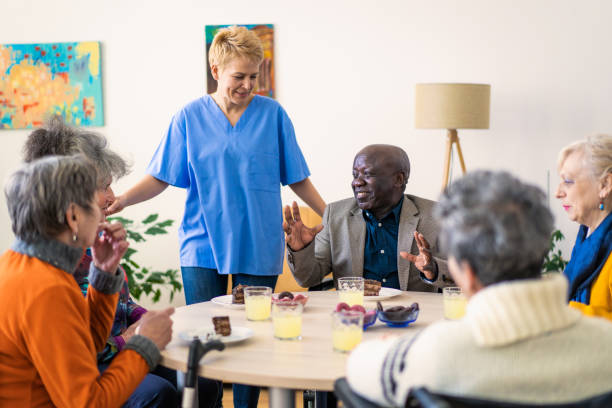 istock A medical assistant with retired residents 1468847730