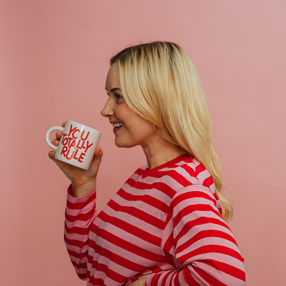 woman with coffee cup with message - you totally rule
Photo taken in studio