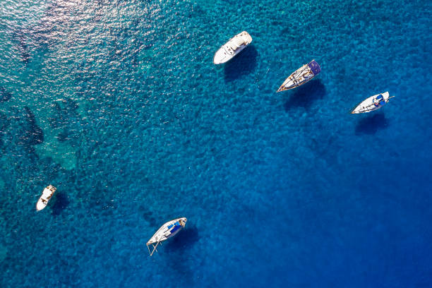 istock Boats anchored on blue waters 1468849579