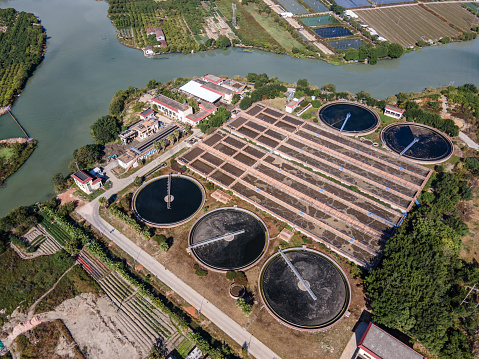 Aerial view of square and circular sewage treatment tanks of sewage treatment plant