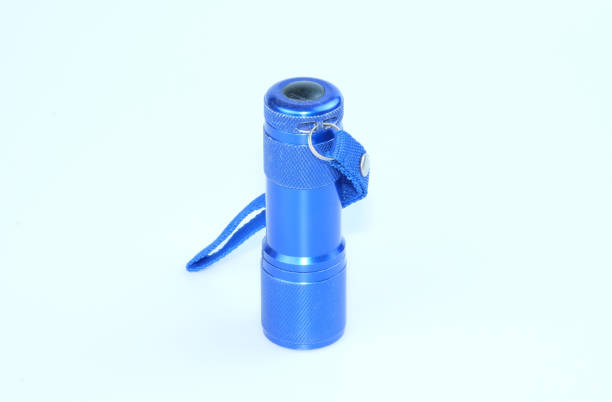 istock Blue Portable Metal Flashlight isolated on white background 1468852350