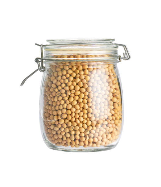 istock soybeans in glass storage jar isolated on white background. 1468854203