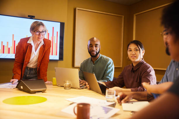istock Manager talking with her business team during a board room meeting 1468854424