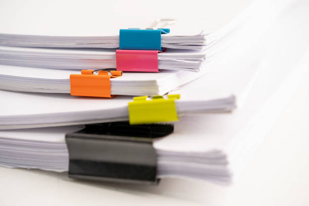 istock White note paper with paperclip on white background. 1468854913