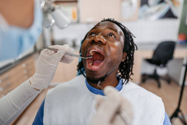 istock Young Man Having A Dental Treatment At The Dentist's Office 1468856410