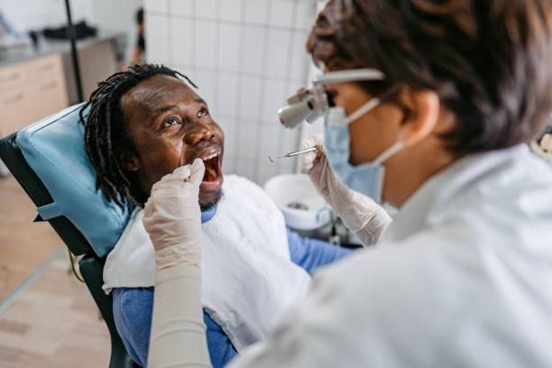 istock Young Man Having A Dental Treatment At The Dentist's Office 1468856435