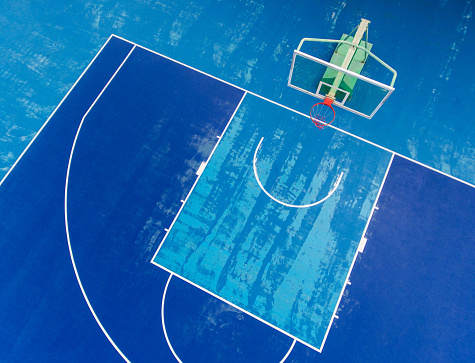 Top view of the basketball court in Shanghai. Old blue court aerial view