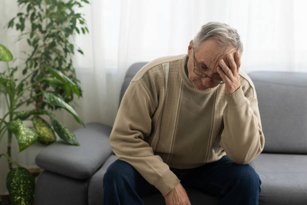 istock Elderly man with hand on his temple has a headache 1468861280