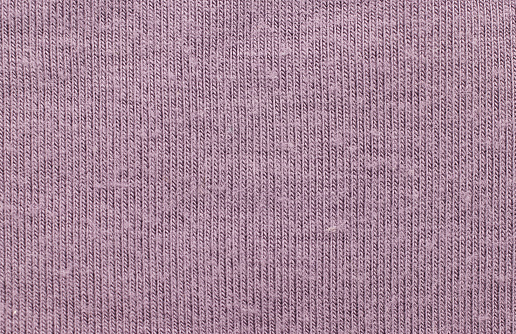 close up photo of rough purple fabric texture background