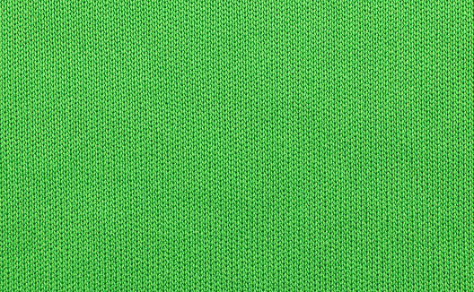 green color fabric texture for wallpaper and an abstract background.closeup