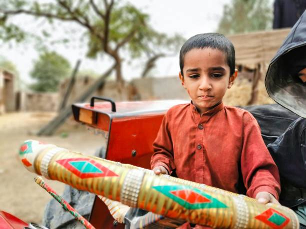istock a young boy is driving a tractor 1468862535