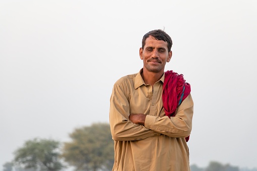 a south Asian farmer smiling