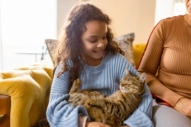 istock Slippy cat in little girls hands 1468863537
