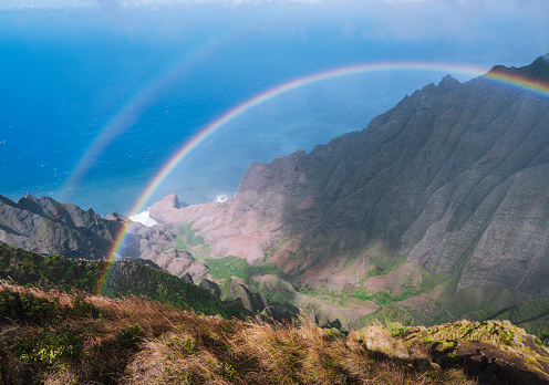 Double rainbow over Na Pali coast in Kauai Hawaii island USA
