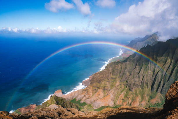 Double rainbow over Na Pali coast in Kauai Hawaii island USA Double rainbow over Na Pali coast in Kauai Hawaii island USA north shore stock pictures, royalty-free photos & images