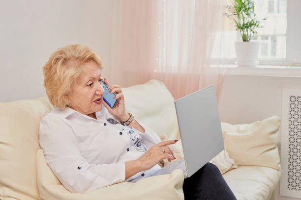 istock Smiling senior woman having conversation on phone 1468866131