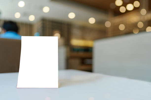 istock Blank menu frame put on wooden table in cafe or restaurant. 1468866243