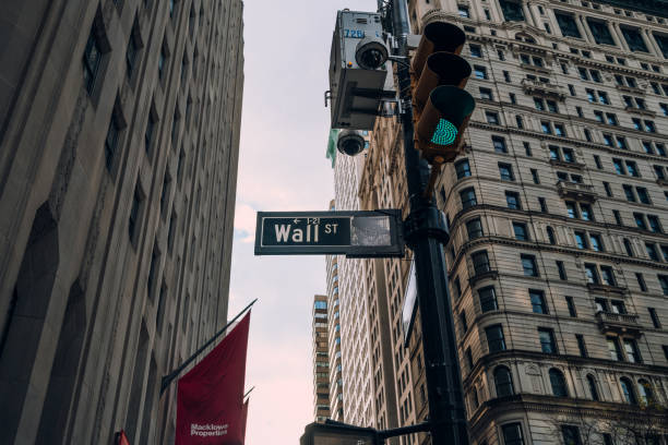 Street name sign on Wall Street in Financial District, New York City, USA. stock photo