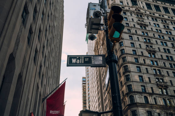 street name sign on wall street in financial district, new york city, usa. - wall street new york stock exchange street new york city imagens e fotografias de stock