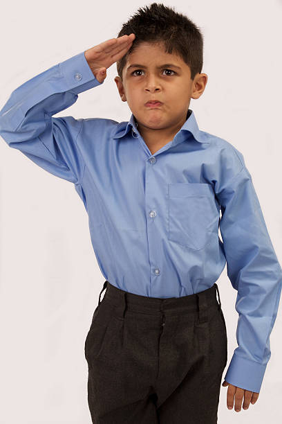 School boy saluting stock photo