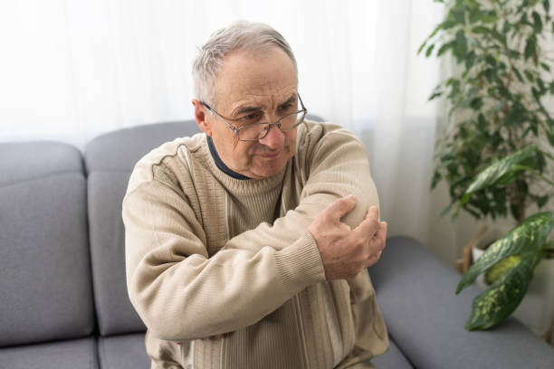 istock an elderly man hurts his elbow 1468882756