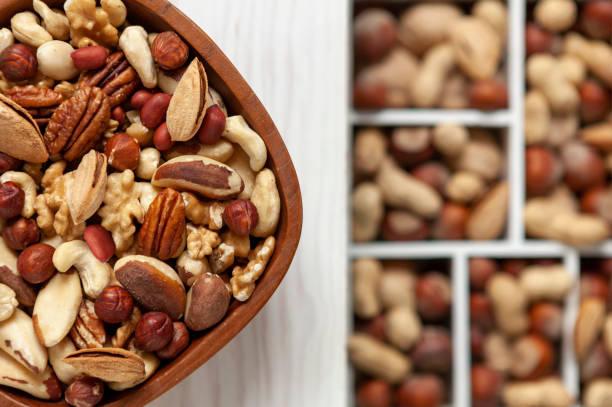 istock Mix of various nuts in the bowl in rustic style 1468885738