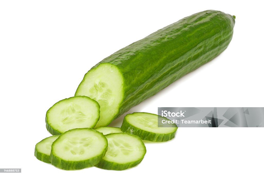 Cucumber Close-up of a sliced cucumber - isolated on white background Chopped Food Stock Photo