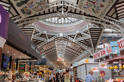 Valencia, Spain - july 2022: Interior Spaces, People and Architecture of the Mercado Central, the principal Food Market in Valencia, Spain.