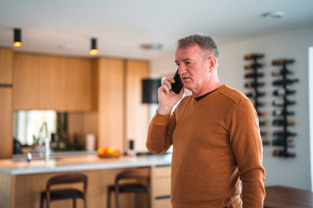 istock Mature Caucasian On A Phone Call At Home 1468892367