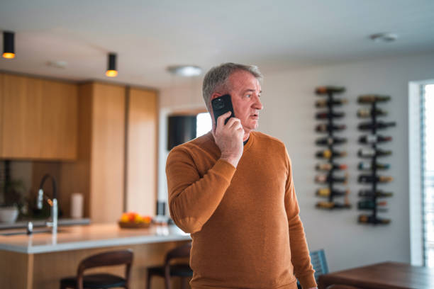 istock Mature Caucasian On A Phone Call At Home 1468892372