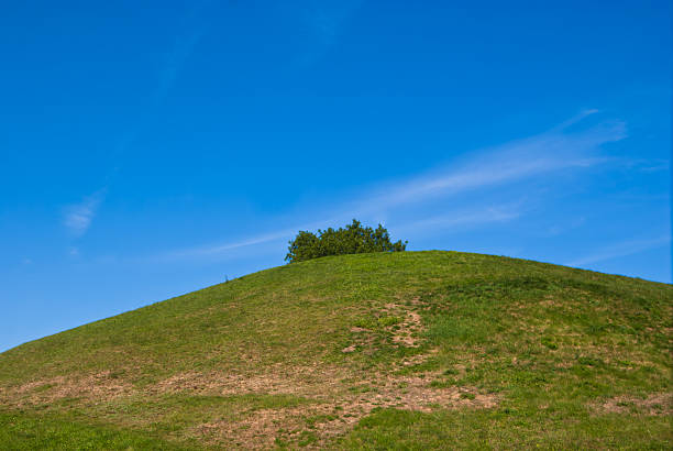 istock Beautiful Northern Landscape, Green Mound Against BLue Cloudy Sky 146889342