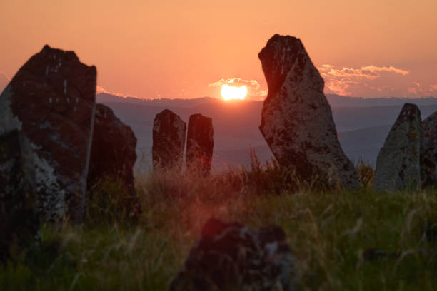 View of the ancient burial mounds and menhirs in the steppes and mountains of Khakassia, Russia.