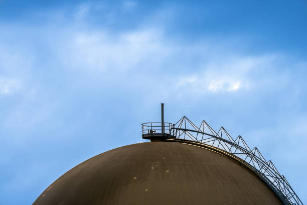 istock Low angle view of of storage tank against cloudy sky 1468896752