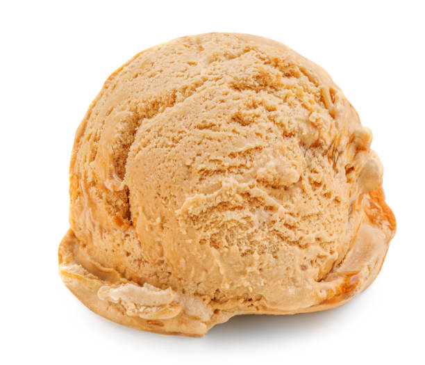 Caramel Ice cream scoop isolated on a white background with caramel syrup