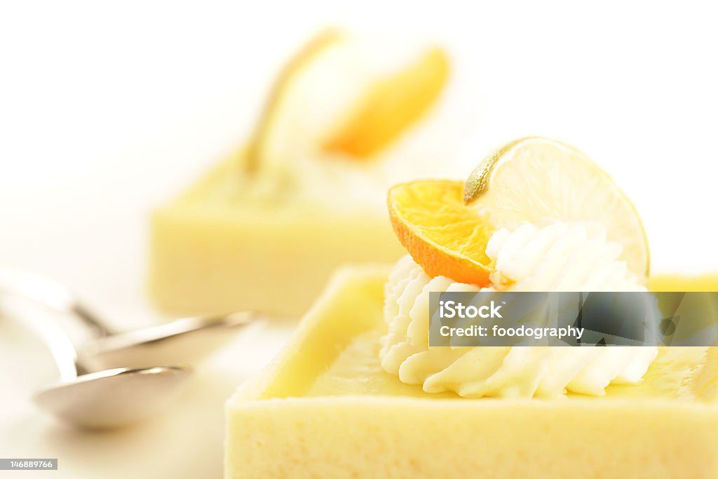 Two pastries Decadent key lime tarts with whipped cream and citrus garnish Baked Stock Photo