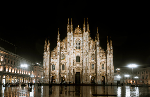 At night, the Milan Cathedral or Duomo di Milano, one of the largest churches in the world, is a stunning sight on Piazza Duomo square in the heart of Milan, Italy